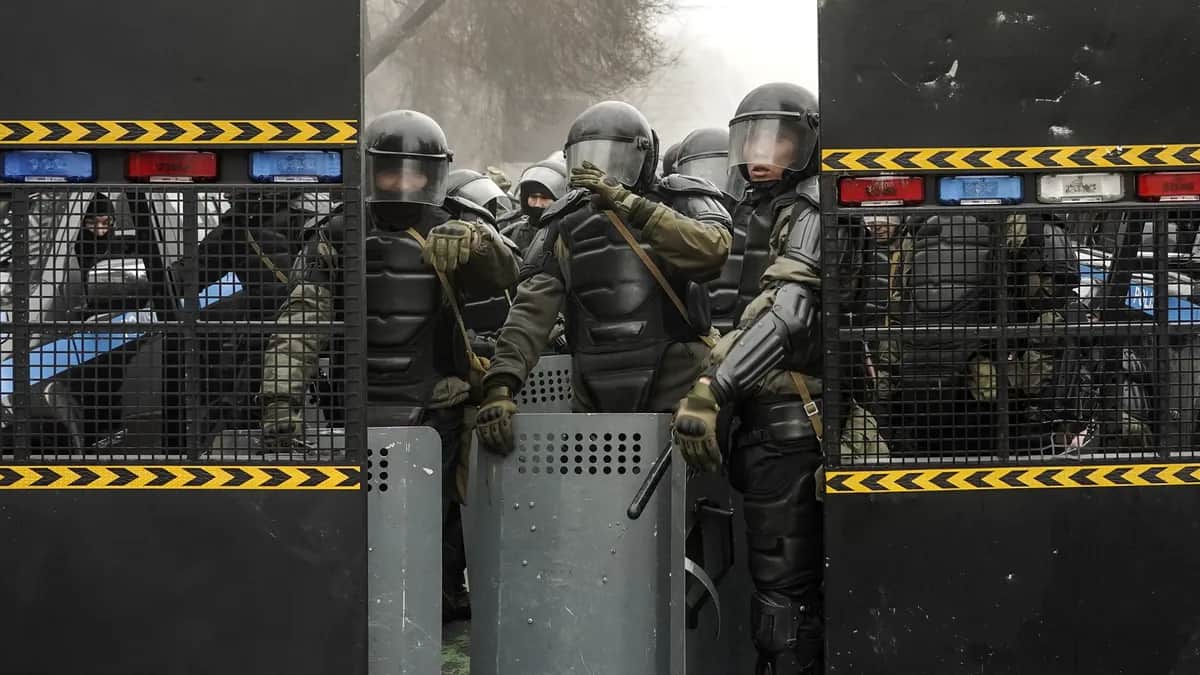 Riot police block a street during a protest against fuel cost rises in Almaty, Kazakhstan, 5 January 2022. Photo: EPA