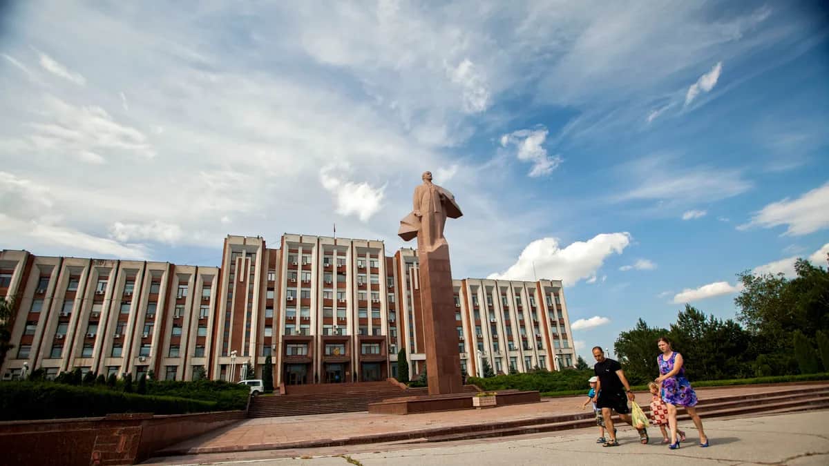 People walk past the unrecognised breakaway region of Transnistria’s Supreme Council in Tiraspol. Photo: EPA / DUMITRU DORU