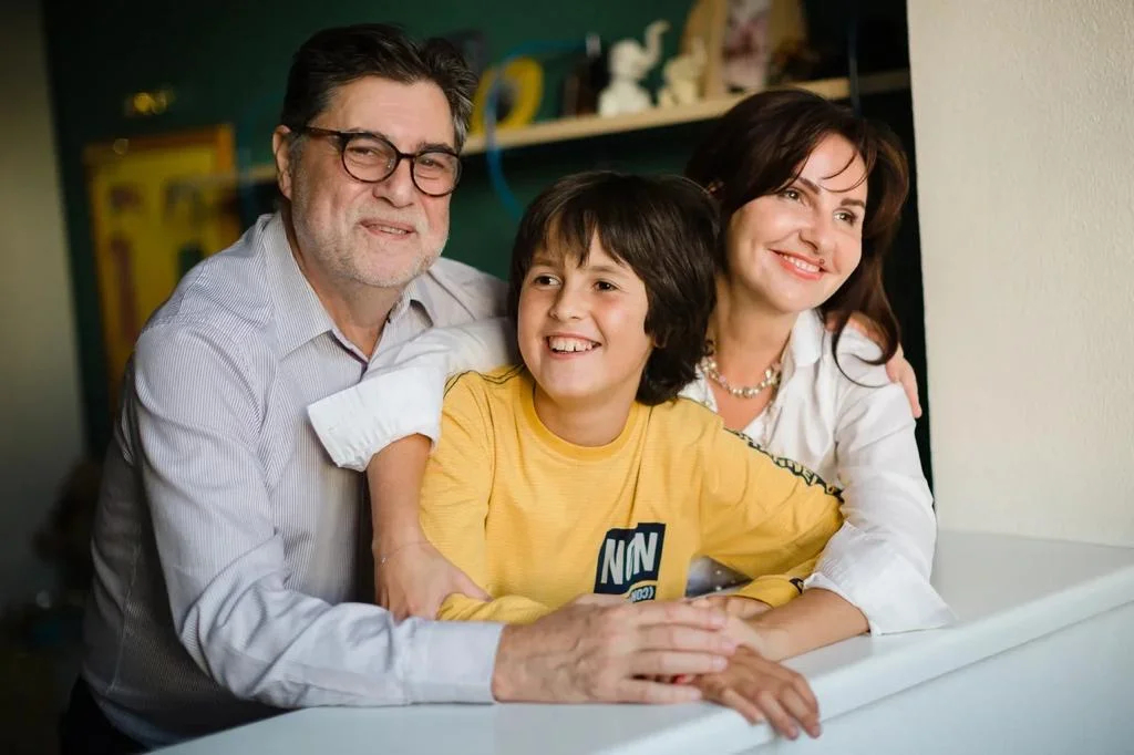 Sergey Zuev with his youngest son Gleb and his wife Elizaveta. Photo from the family archive