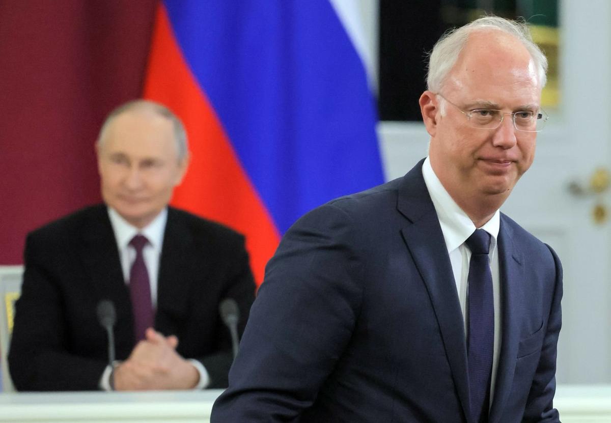 Vladimir Putin looms in the background as Kirill Dmitriev attends a signing ceremony at the Kremlin in Moscow, 17 April 2025. Photo: EPA/Maxim Shipenkov